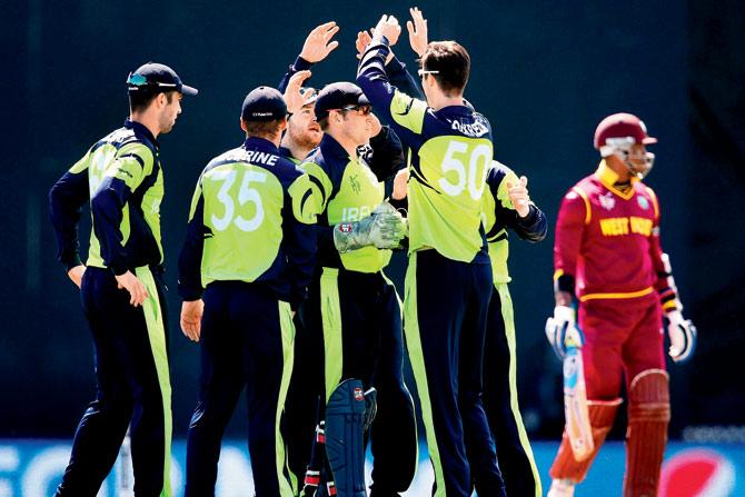 Ireland players celebrate a WI wicket during their opening World Cup match at Saxton Field in Nelson, New Zealand on Monday. PIC/Getty Images