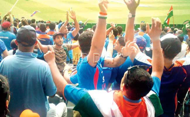 Fans dance to the beats of a dholak at the erstwhile Bay 13 (now M6) at the Melbourne Cricket Ground yesterday. Pic/Ashwin Ferro