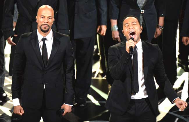 Musicians Common (L) and John Legend perform the song 