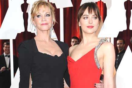 Why is Dakota Johnson miffed at her mother?