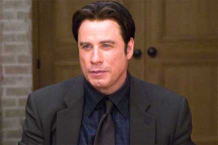 John Travolta's 'awkward' run-ins with Scarlett, Idina at Oscars