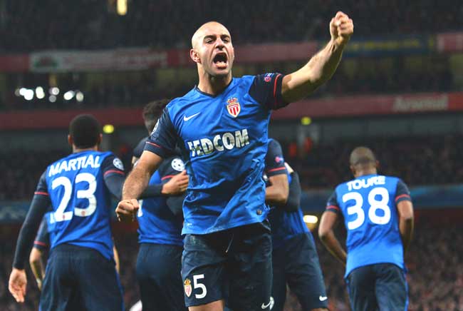 Monaco-s Tunisian defender Aymen Abdennour C celebrates his team-s second goal scored by Monaco-s Bulgarian forward Dimitar Berbatov during the UEFA Champions League round of 16 first leg football match between Arsenal and Monaco at the Emirates Stadium in London. Pic/AFP
