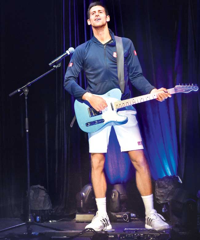 Novak Djokovic plays the guitar at ANZ Jam Slam during the 2015 Australian Open at Melbourne Park. Pic/Getty Images