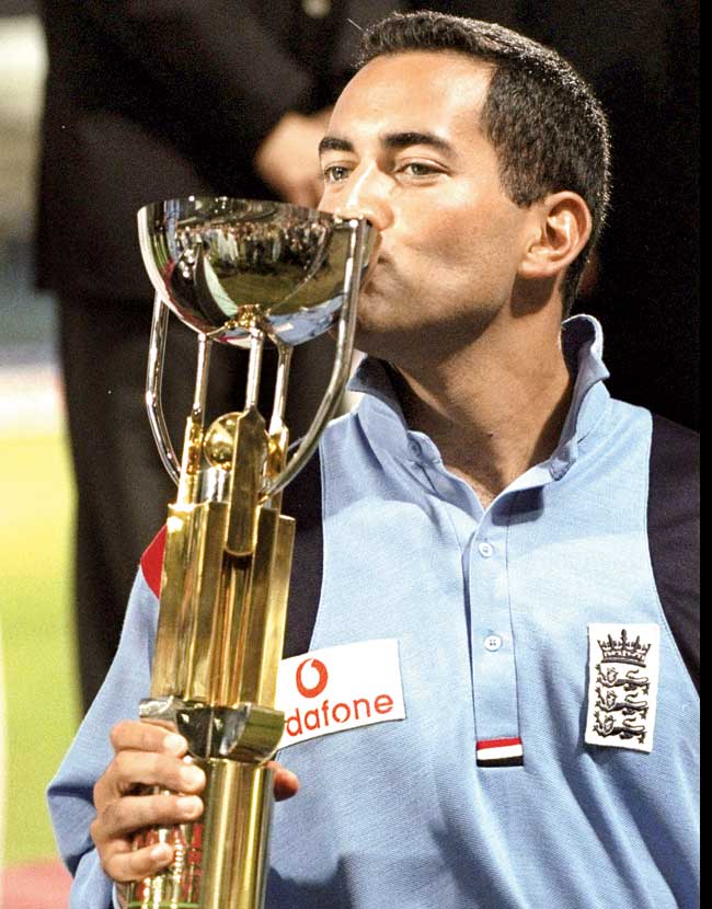 England captain Adam Hollioake kisses the Champions Trophy at Sharjah in 1997. Pic/Getty Images