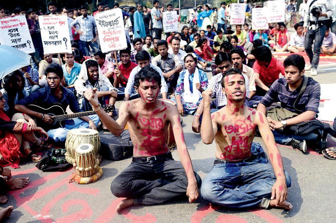 Remembering Avijit Roy: Hundreds of Bangladeshis gathered to protest against the killing of writer Avijit Roy,  who was hacked to death by unidentified assailants in Dhaka on February 26.  Pic/AFP