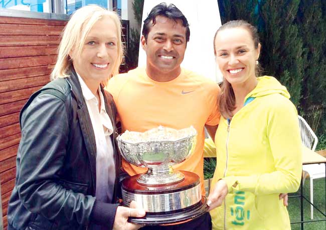 Lee & his martinas: Martina Navratilova left poses with Australian Open mixed doubles champions Leander Paes and Martina Hingis at Melbourne Park yesterday. At the presentation ceremony, Hingis thanked Navratilova for "lending Leander" to her. Navratilova and Paes had won the title here in 2003 