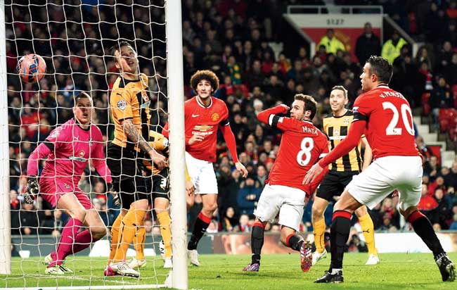 Juan Mata (third from right) scores Manchester United