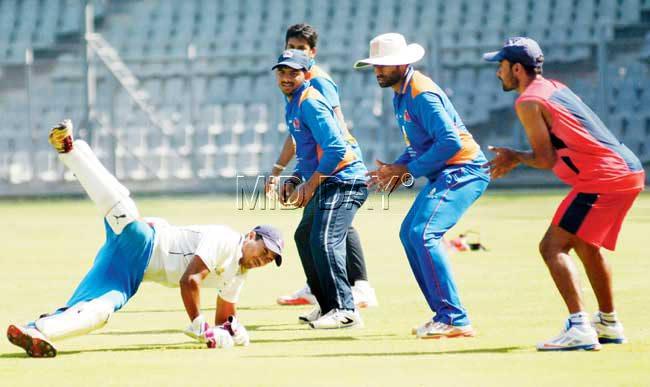 Aditya Tare dives during a practice session at Wankhede Stadium yesterday. Pics/Atul Kamble