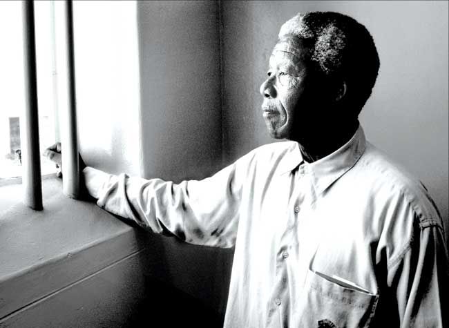 Nelson Mandela visits the Robben Island cell, where he spent 19 years in prison, in 1994. Pics Courtesy/David Turnley