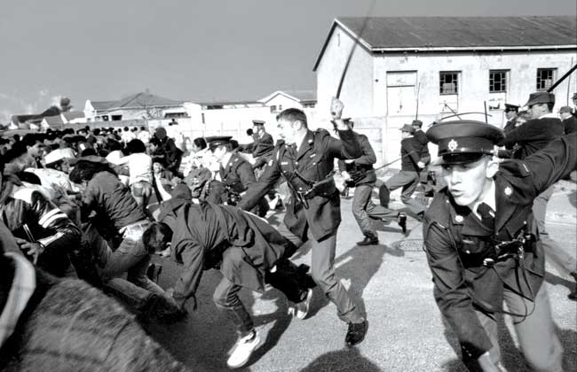 Officers dispersing people by whipping in South Africa