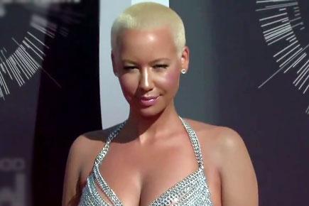 Amber Rose threatens Kanye West, Kim Kardashian