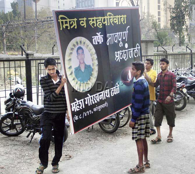 Relatives and friends have put up hoardings in their locality in Kanjurmarg to pay homage to Mahesh. Pic/Sameer Markande