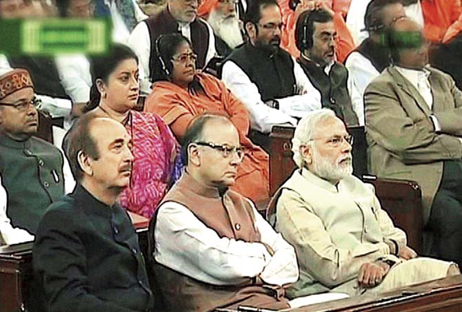 Prime Minister Narendra Modi with Finance Minister Arun Jaitley and other Members of Parliament during the President’s address in the Joint Session of both Houses of Parliament at the beginning of the Budget session in New Delhi, yesterday. Pic/PTI / TV Grab