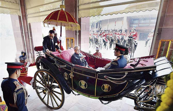President Pranab Mukherjee arrives in a buggy to address the Joint session of Parliament on the first day of Budget session in New Delhi, yesterday. By the way, the columnist just said, hold your horses, in the piece below. We do not think he meant the horses pulling the Prez’s buggy! Pic/PTI