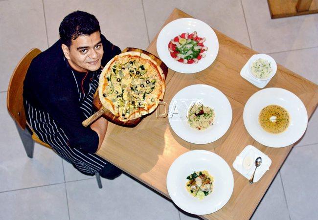 Chef Viren Joshi with lean dishes like Four Seasons Pizza, Tenderloin Carpaccio, Puy Lentil Ragout with Herb Pilaf, Couscous Upma and Indian Salmon at Café Sundance. PIC/Bipin Kokate