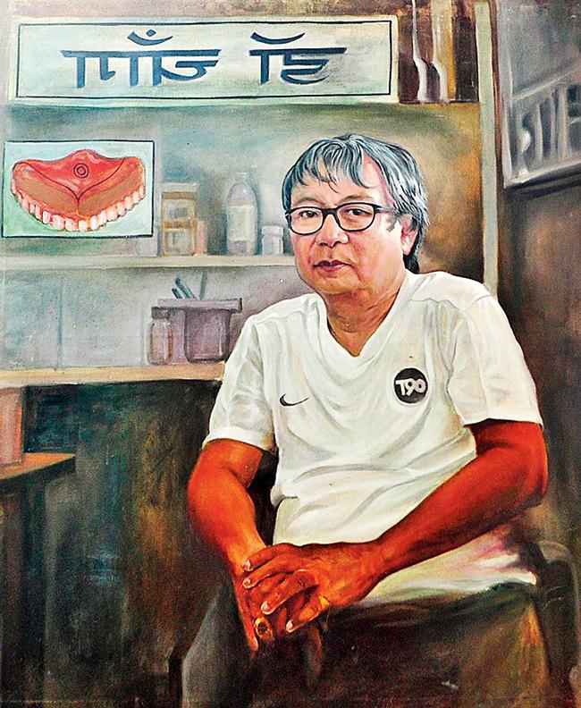 Handpainted sign artist Sham Jadhav’s painting of Dr Chang, a Dharavi-based dentist, which will be exhibited at the Dharavi Biennale
