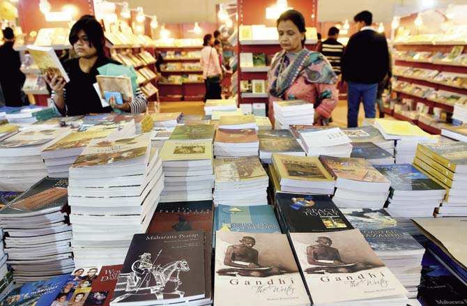 Book lovers browse through a collection of English books inspired from Indian themes at an Indian book fair. Pic/AFP