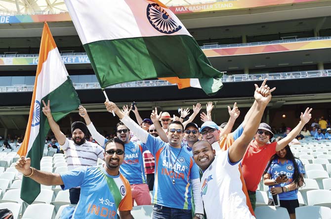 Indian fans cheer during the ICC Cricket World Cup warm up match. Pic/AFP