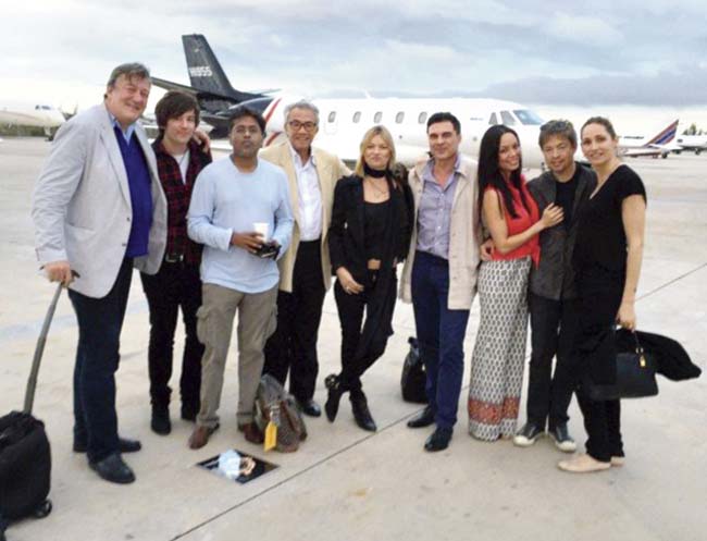 Stephen Fry, Lalit Modi, Sire David Tang with friends at Nassau airport