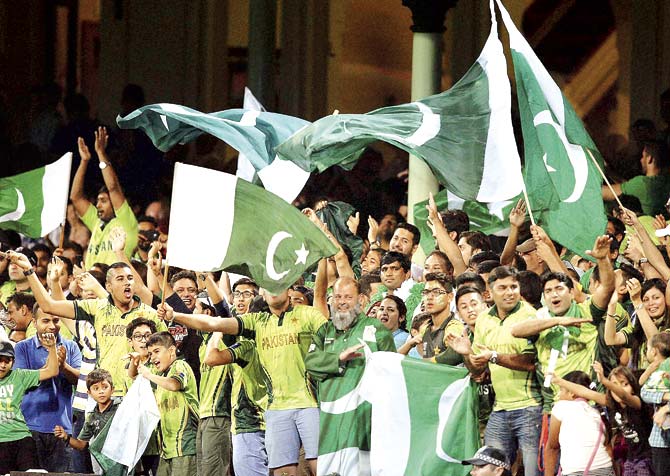 The glue that binds a nation: Pakistani cricket fans celebrate after their team’s win against England in a World Cup warm-up match in Sydney. The team will play against the defending champions, India, on Sunday.  Pic/AP/PTI