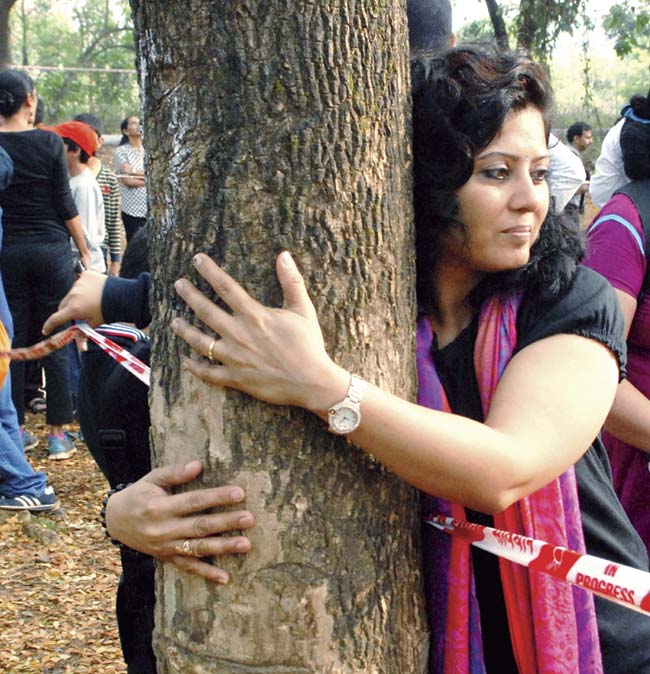 Schoolkids and their parents participate in a campaign to save trees at Aarey Milk Colony. File pic