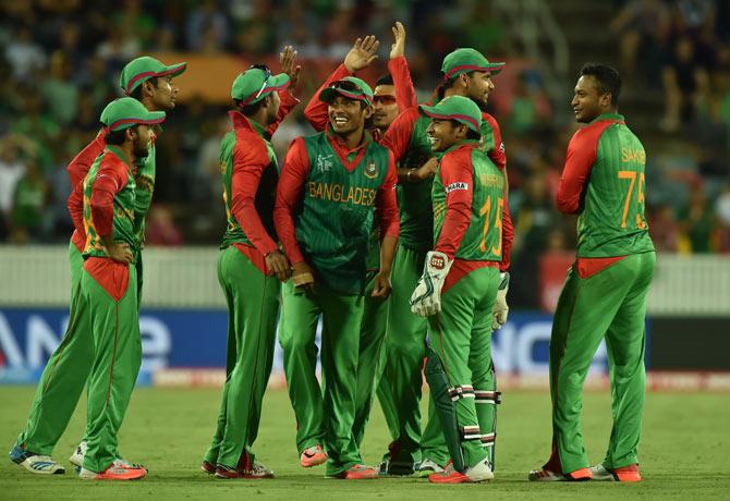 Bangladesh cricketers celebrate a wicket