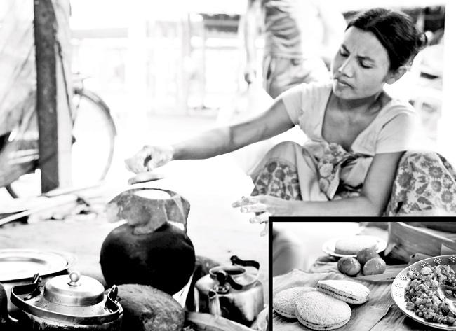 A Bodo woman making a traditional bodo pitha made with ground rice, sesame seeds, or ground coconut and sugar Ujjayanta Palace at Tripura