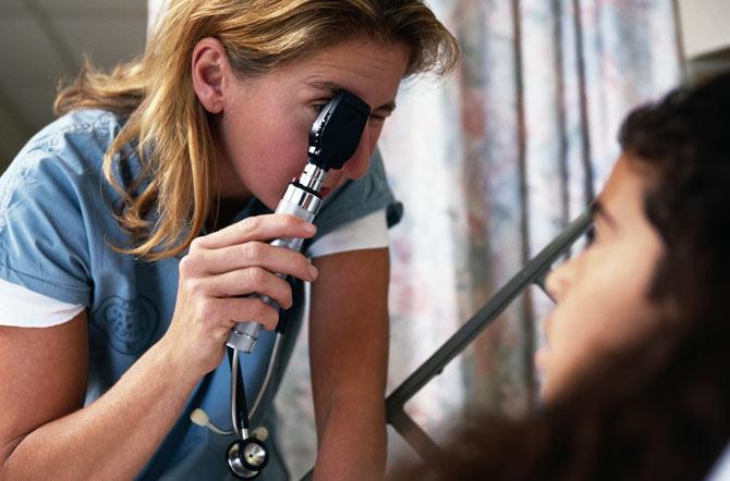 An ophthalmoscope in use during an ophthalmoscopy. Picture for representational purposes