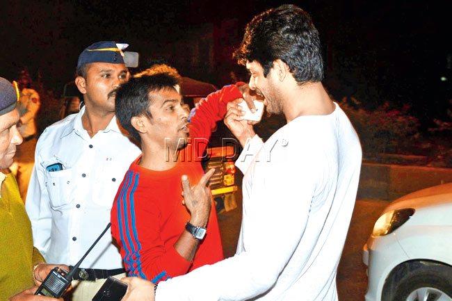 Sidharth Shukla (in white) confronts the youth who was  filming him as he was slapped with drunk driving charges on late Wednesday night. PIC/ Sayyed Sameer Abedi 