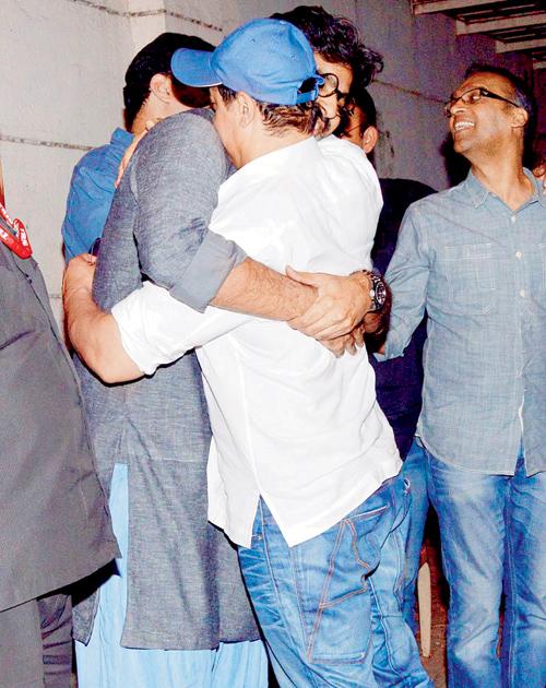 Aamir Khan hugs a crew member 