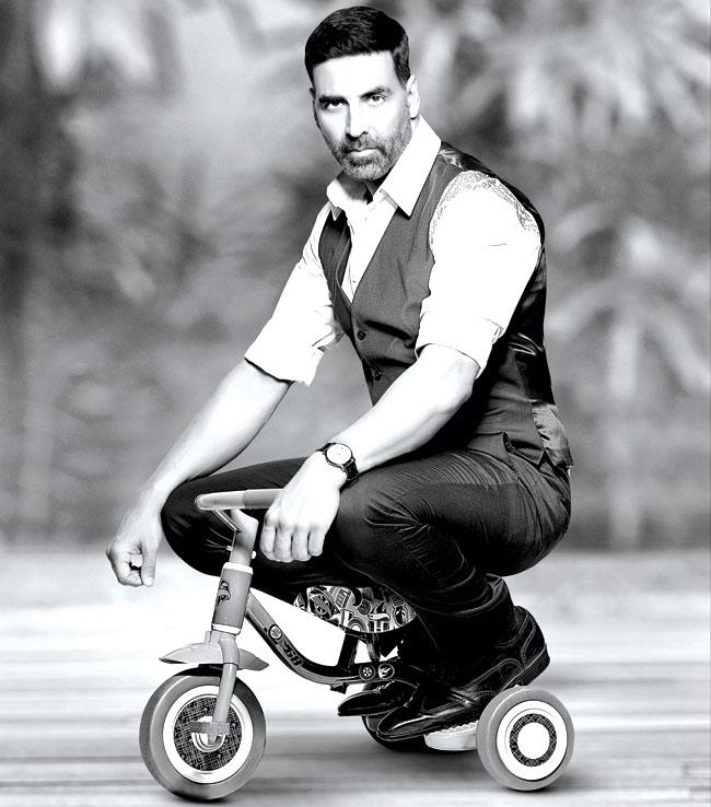 Akshay Kumar on a kiddie tricycle looks cute, charming and cool, all rolled into one frame