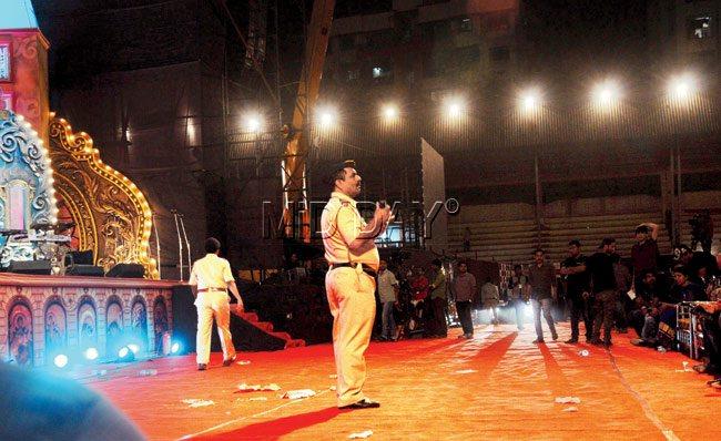 Police officials stop the show after it exceeds the midnight deadline. PICS/SATYAJIT DESAI 