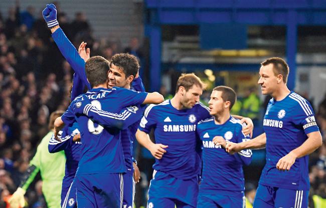 Chelsea players celebrate a goal against Newcastle United on Saturday. Pic/AFP