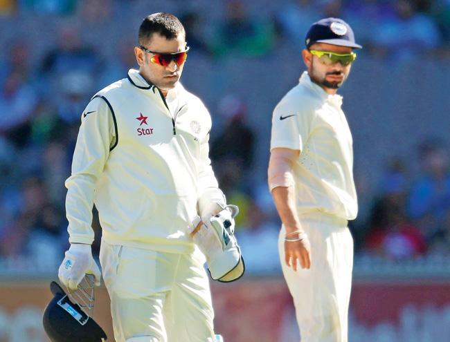 MS Dhoni and Virat Kohli during the third Test at Melbourne Cricket Ground last month. Pic/Getty Images