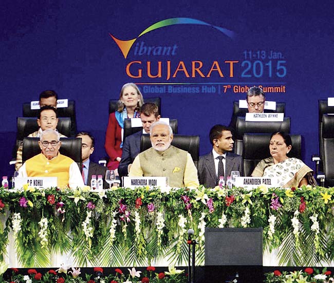 Narendra Modi (c) with Gujarat Governor OP Kohli (l) and Chief Minister Anandiben Patel (r) during the Vibrant Gujarat Global Summit-2015 at Mahatma Mandir in Gandhinagar. Pic/PTI
