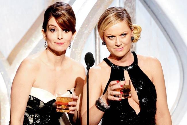 Tina Fey (left) and Amy Poehler co-hosted for the third and final time together