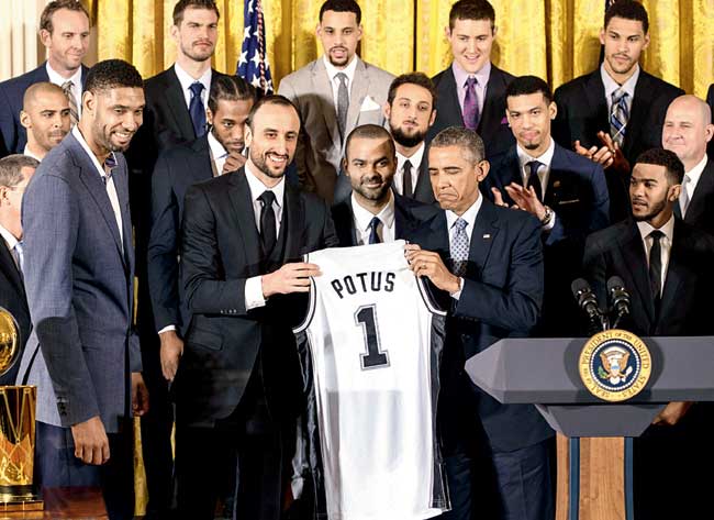 US President Barack Obama with San Antonio Spurs players at the White House in Washington DC on Monday. Pic/AFP