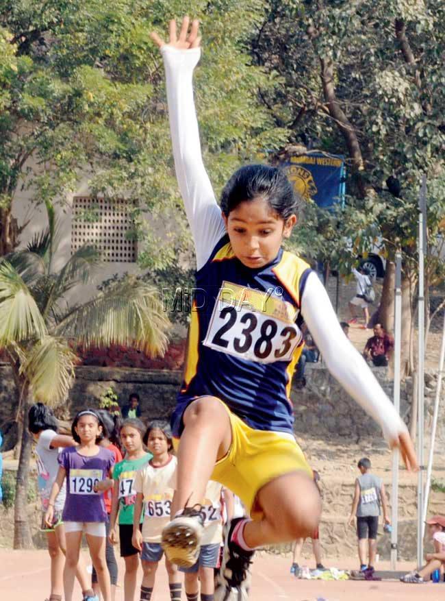 Up she goes: Navya Shetty competes in the U-8 long jump event at the MSSA athletics meet in Kandivli yesterday. Pic/Nimesh Dave