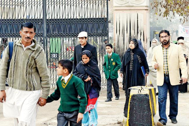Back to school: Child survivors of the recent terror attack on the Army Public School in Peshawar returned to school on January 12. The images of students entering the school and parents seeing them off pulled at everyone’s heartstrings. Nobody could hold back their tears after seeing those scenes on their television screens. Pic/AFP