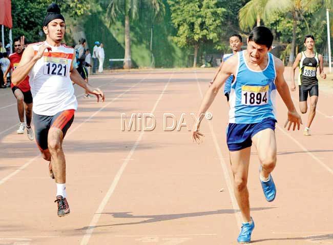 Alden Noronha (right) wins the U-16 200m event while Sahib Singh finishes second at the MSSA inter-school athletics meet held at Sports Authority of India