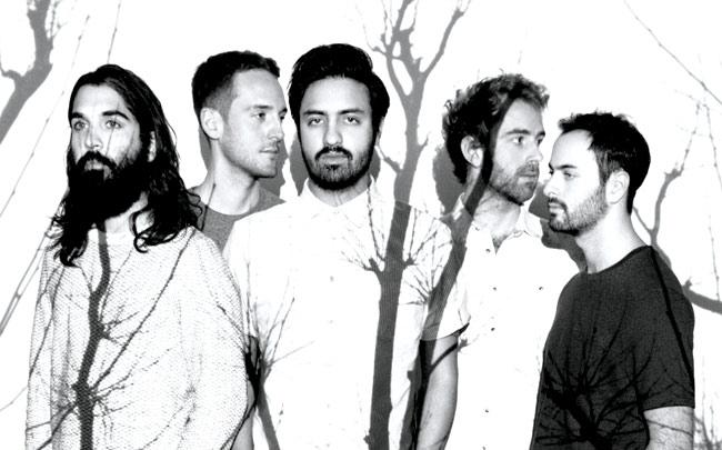 Sameer Gadhia (Centre) with his bandmates from Young The Giant