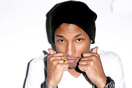 Why does Pharrell Williams like women's company?