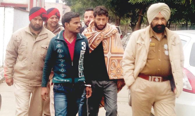 NABBED: Rajpura police have caught four persons, including mastermind Sadre Alam (in green sweater), who were involved in the robbery
