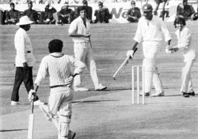 January 24, 1975: An enthusiastic fan (identified in the media then as Yogesh Maganlal Bharot) congratulates Clive Lloyd on his double ton as the umpire, Karsan Ghavri and non-striker Deryck Murray look on. Pics courtesy: Living for Cricket by Clive Lloyd 