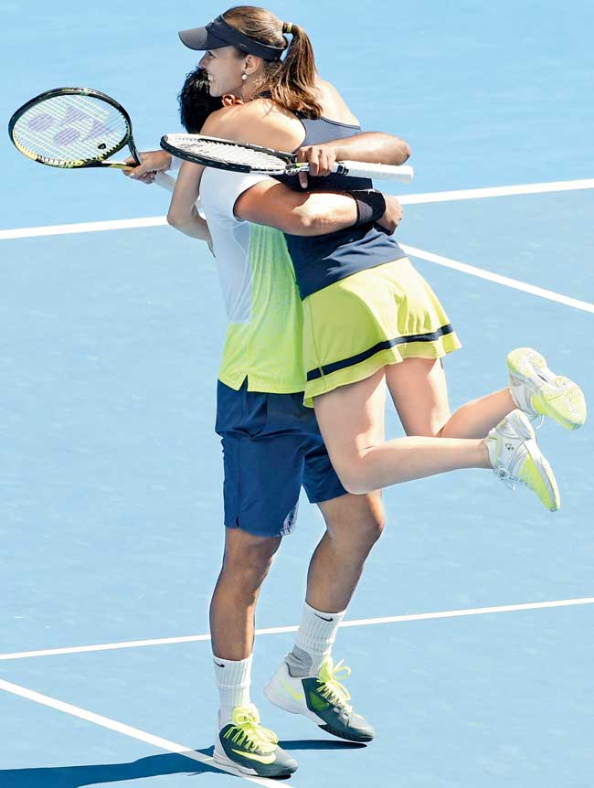 Leander Paes and Martina Hingis celebrate their Australian Open mixed doubles semi-final win over Hsieh Su-Wei and Pablo Cuevas at Melbourne Park yesterday. Pic/AFP