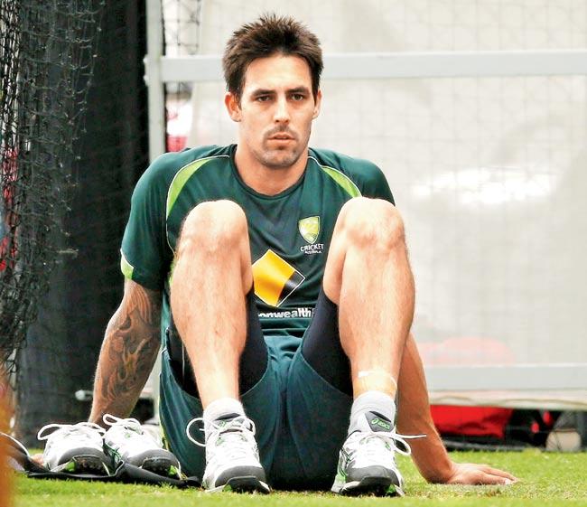Tough times: Paceman Mitchell Johnson takes a break during an Australian nets session at the Adelaide Oval on December 7, 2014 ahead of the opening Test of the four-match series. Pic/Getty Images