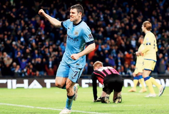 James Milner celebrates after scoring  Manchester City