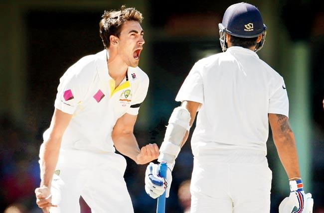 Australia pacer Mitchell Starc celebrates after dismissing Murali Vijay for a duck in Sydney yesterday. Pic/Getty Images