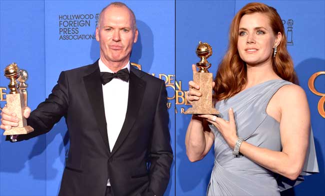 Michael Keaton and Amy Adams pose with their trohpy for Best Performance in a Motion Picture - Musical/Comedy for 