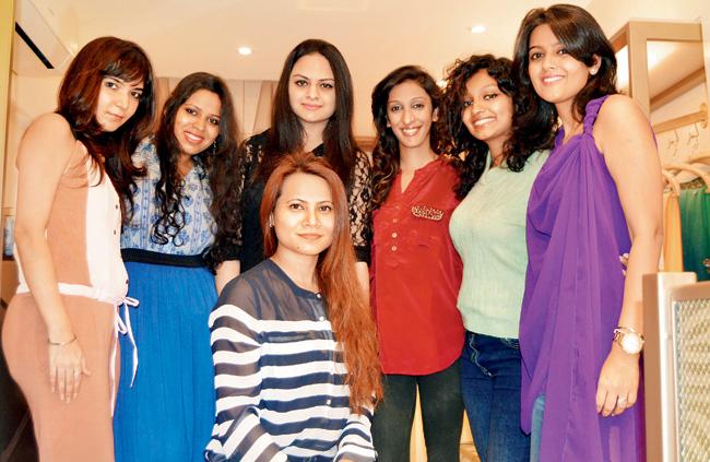 Anjoo Karanjia (kneeling, centre) with her team at Anj Kreations